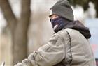 Cool, rainy weather in Saskatoon has cyclists like Ken Benezowski pulling out the winter clothing once more, Friday.