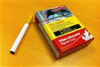 A Canadian brand cigarette and pack are shown on Wednesday Nov. 14, 2012 in Toronto. The Canadian Cancer Society says three-quarters of the space on Canadian packaging is now devoted to pictures and text discouraging smokers from lighting up, placing Canada fourth in a ranking of 198 countries. THE CANADIAN PRESS/Denis Savard