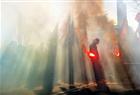A man holds a flare as thousands of people from France and Belgium demonstrate during an anti-austerity protest in Lille on November 14, 2012. Trade unions lead nationwide strikes and anti-austerity protests across Europe today.